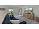 Spacious living room with comfortable seating, a large TV, and access to the backyard at 6107 116Th E Ave, Parrish, FL 34219