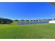 Scenic pond view with a lush grassy area at 6107 116Th E Ave, Parrish, FL 34219