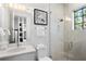 Modern bathroom with a walk-in shower and floating vanity at 741 Jacaranda Rd, Anna Maria, FL 34216