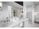 Elegant bathroom with double vanity and marble counters at 741 Jacaranda Rd, Anna Maria, FL 34216