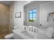 Modern bathroom with marble vanity and glass shower at 741 Jacaranda Rd, Anna Maria, FL 34216
