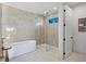 Spa-like bathroom with walk-in shower and free-standing tub at 741 Jacaranda Rd, Anna Maria, FL 34216