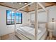 Bedroom with ocean view and four-poster bed at 741 Jacaranda Rd, Anna Maria, FL 34216