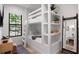 Charming bedroom with built-in bunk beds and ample storage at 741 Jacaranda Rd, Anna Maria, FL 34216