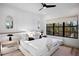 Spacious bedroom with large window, comfortable bed, and stylish decor at 741 Jacaranda Rd, Anna Maria, FL 34216
