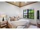 Spacious bedroom with a king-size bed and large windows at 741 Jacaranda Rd, Anna Maria, FL 34216