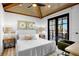 Comfortable bedroom with private balcony and en-suite bathroom at 741 Jacaranda Rd, Anna Maria, FL 34216
