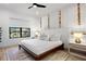 Bright bedroom with a comfortable bed and unique wall art at 741 Jacaranda Rd, Anna Maria, FL 34216