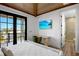 Second bedroom with private balcony and en-suite bathroom at 741 Jacaranda Rd, Anna Maria, FL 34216