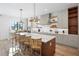 Gourmet kitchen with island, modern appliances, and wood cabinetry at 741 Jacaranda Rd, Anna Maria, FL 34216