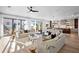 Spacious living area with open floor plan and kitchen access at 741 Jacaranda Rd, Anna Maria, FL 34216