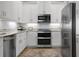 Modern kitchen featuring stainless steel appliances and white shaker cabinets at 7910 34Th W Ave # 301, Bradenton, FL 34209