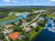 Aerial view of home with pool and lush landscaping at 8843 Wild Dunes Dr, Sarasota, FL 34241