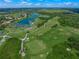 Aerial view of the community golf course with lakes and fairways at 8843 Wild Dunes Dr, Sarasota, FL 34241