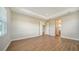 Large bedroom featuring wood-look floors and access to other rooms at 10142 Crystal Isles Cir, Sarasota, FL 34241