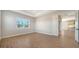 Spacious bedroom with wood-look floors and kitchen view at 10142 Crystal Isles Cir, Sarasota, FL 34241