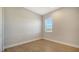 Simple bedroom with wood-look floors and a window at 10142 Crystal Isles Cir, Sarasota, FL 34241