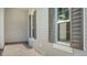 Side entrance with gray walls and dark brown shutters at 10142 Crystal Isles Cir, Sarasota, FL 34241
