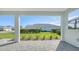 Landscaped backyard with privacy hedge and patio access at 10300 Lake George Ave, Sarasota, FL 34241