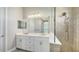 Modern bathroom with double vanity and walk-in shower at 10300 Lake George Ave, Sarasota, FL 34241