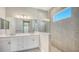 Double vanity bathroom with large walk-in shower at 10300 Lake George Ave, Sarasota, FL 34241