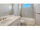 Bathroom with single vanity, bathtub and tile flooring at 10300 Lake George Ave, Sarasota, FL 34241