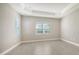 Well-lit bedroom featuring tile floors and neutral walls at 10300 Lake George Ave, Sarasota, FL 34241