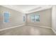Spacious bedroom with tile flooring and multiple windows at 10300 Lake George Ave, Sarasota, FL 34241