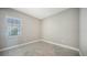 Bright bedroom with tile flooring and window at 10300 Lake George Ave, Sarasota, FL 34241