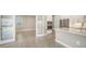 Open kitchen with island and access to adjacent room at 10300 Lake George Ave, Sarasota, FL 34241