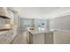 Open concept kitchen with island and stainless steel appliances at 10300 Lake George Ave, Sarasota, FL 34241