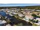 An aerial view showcasing the home's waterfront position and canal access at 10307 Sandpiper W Rd, Bradenton, FL 34209