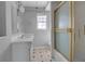 Bathroom with double vanity, shower/tub, and window at 10307 Sandpiper W Rd, Bradenton, FL 34209