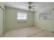 Bedroom with ceiling fan and two windows at 10307 Sandpiper W Rd, Bradenton, FL 34209