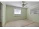 Bedroom with ceiling fan, window, and closet at 10307 Sandpiper W Rd, Bradenton, FL 34209