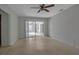 Bedroom with light walls, ceiling fan and sliding glass doors at 10307 Sandpiper W Rd, Bradenton, FL 34209