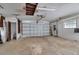 Spacious garage with overhead storage and workshop area at 10307 Sandpiper W Rd, Bradenton, FL 34209