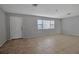 Spacious living area featuring tile floors and large windows at 10307 Sandpiper W Rd, Bradenton, FL 34209
