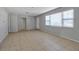 Open living area with tile flooring and access to other rooms at 10307 Sandpiper W Rd, Bradenton, FL 34209