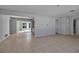 Open concept living room with view into kitchen and access to lanai at 10307 Sandpiper W Rd, Bradenton, FL 34209