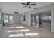 Sunroom with light flooring, ceiling fan, and access to the outdoors at 10307 Sandpiper W Rd, Bradenton, FL 34209