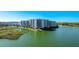 Beautiful building exterior with waterfront views and lush landscaping at 10520 Boardwalk Loop # 202, Lakewood Ranch, FL 34202