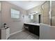 Modern bathroom with vanity, large shower, and updated flooring at 12035 Aster Ave, Bradenton, FL 34212