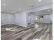 Open living room with hardwood floors and lots of natural light at 12302 Tangier St, North Port, FL 34287