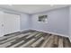 Spacious bedroom with wood-look floors and double door closet at 12302 Tangier St, North Port, FL 34287