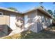 Rear house view showing AC unit and two exterior doors at 12302 Tangier St, North Port, FL 34287