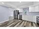 Modern kitchen with stainless steel appliances and white cabinets at 12302 Tangier St, North Port, FL 34287