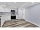 Modern kitchen with stainless steel appliances and white cabinets at 12302 Tangier St, North Port, FL 34287