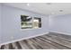 Bright living room featuring large windows and hardwood floors at 12302 Tangier St, North Port, FL 34287