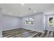 Spacious living room with light gray walls and wood-look floors at 12302 Tangier St, North Port, FL 34287